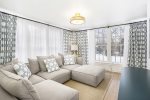 TV room offers and comfortable sectional sofa to sprawl out and enjoy 